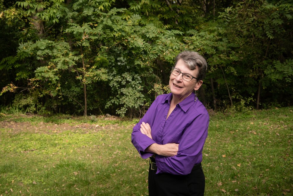 a woman in purple long sleeves